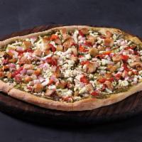 Chicken Pesto Pizza · Basil pesto sauce, feta, grilled chicken, onions, red peppers.