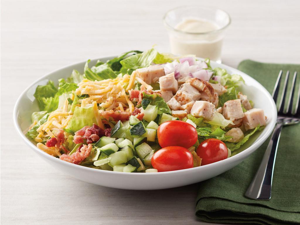 Dilusso Chicken Club Salad · Romaine Lettuce with diced chicken, tomatoes, red onion, cucumber, Colby jack cheese, and bacon pieces.