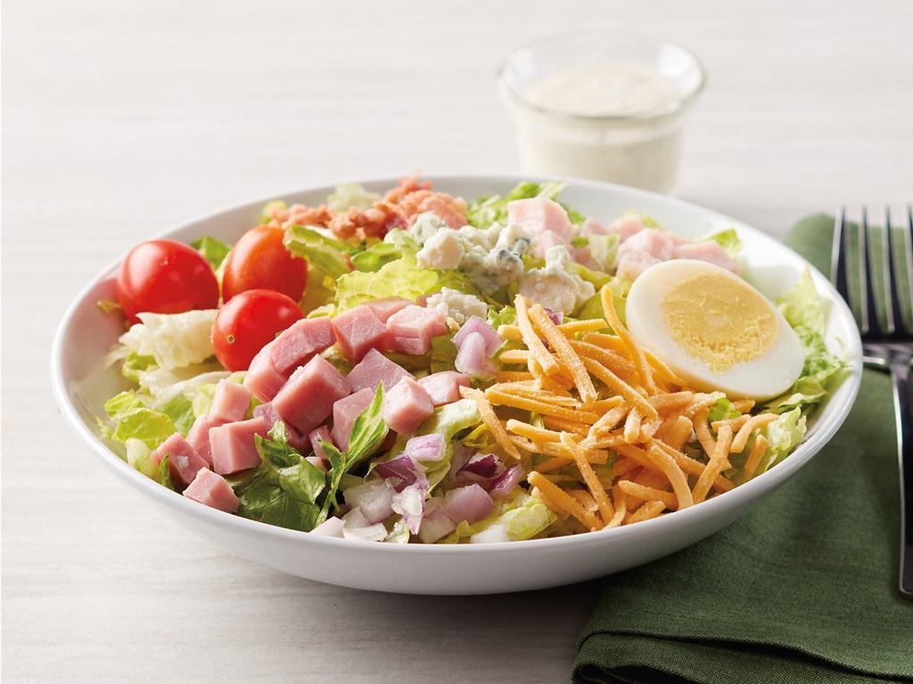 Dilusso Cobb Salad · Romaine Lettuce with tomatoes, eggs, diced ham, diced turkey, cheddar cheese, Blue cheese, bacon pieces, and red onion.