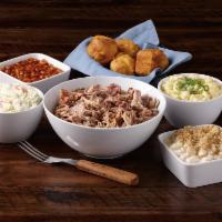 Pulled Pork Dinner for 4 - Served Hot · Includes 2 pounds of Pulled Pork - sauced or unsauced, 4 pint sides of your choice and 4 cor...