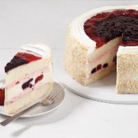 All American Cheesecake · Vanilla cake, strawberry mascarpone mousse and cheesecake swirled with blueberries and straw...