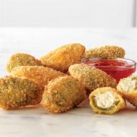 8 Pieces Jalapeño Bites® · Spicy jalapeno halves filled with melted cream cheese, served with a side of Bronco Berry Sa...
