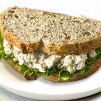 Sandwiches & Wraps|Chicken Salad Sandwich · A grilled chicken sandwich with dill seasoning and mayonnaise on a bed of crispy leaf lettuc...