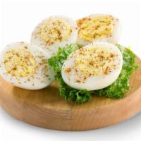 Picnic Boxes|Hard Boiled Egg Box  · One hard boiled egg with paprika sprinkled on a bed of green leaf lettuce. 70 Calories 