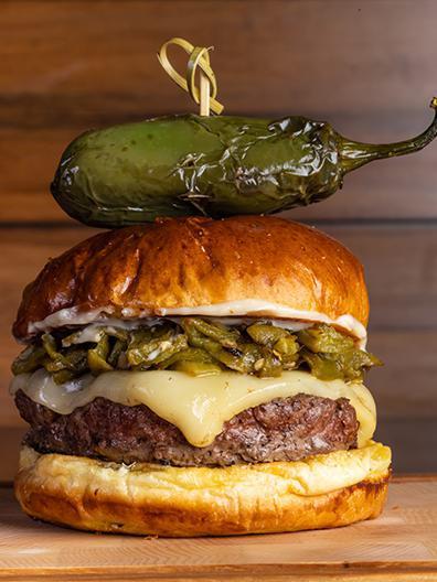Asadero Green Chile Burger · A half lb. of premium ground beef or chicken served with green chiles, asadero cheese and our own bacon mayo.