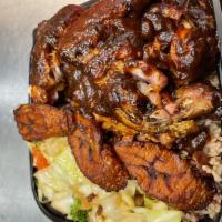 Fire Pit Jerk Chicken platter  · Comes with a choice of sides, cabbage, and plantain. Add a side for an additional charge.