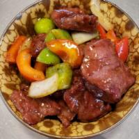 Pepper Steak with Onions · Stir fried steak with vegetables and a savory sauce.