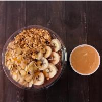 Nutty Bowl · Organic acai topped with sliced banana, natural peanut butter, granola and honey drizzle.