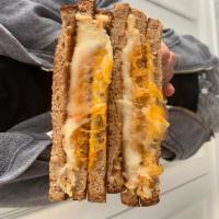 Kid's Grilled Cheese · Mozzarella and cheddar cheese in between 3 slices of multi-grain bread.