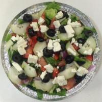 Greek Salad · Black and green olives, cucumbers, peppers, tomatoes, romaine, lettuce and feta.