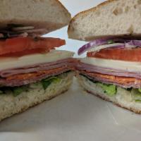 Italian Combo · Ham, salami, provolone cheese, prosciutto, lettuce, tomatoes, and onions with a choice of oi...