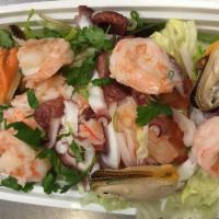 Seafood Salad · Shrimp, calamari and mussel topped with romaine lettuce, tomato, scallion, cilantro and cucu...