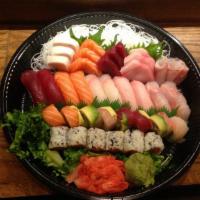 Love Boat for 2 · 10 piece of sushi, fifteen piece of sashimi and dragon roll and rainbow roll. Served with so...