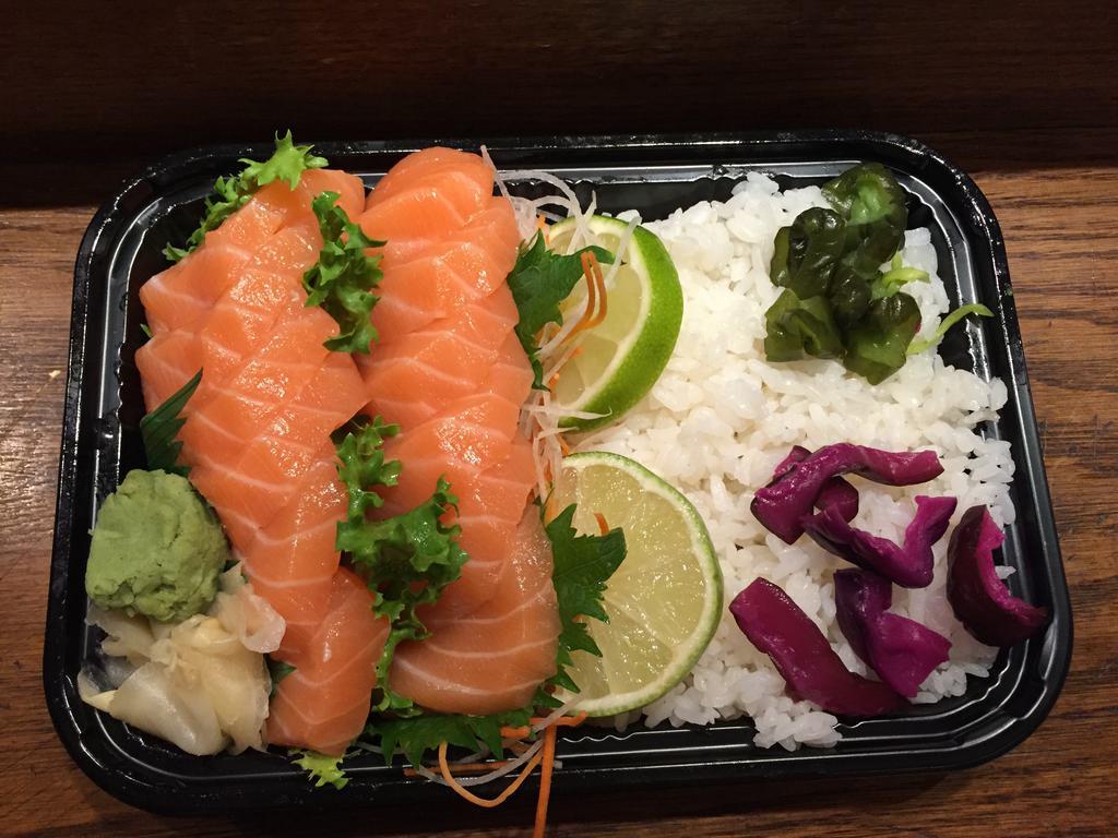 Salmon Lover · 7 pieces of salmon sushi and 1 salmon avocado roll. 