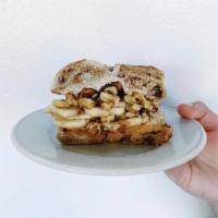 The Bachelorette · Brown sugar cinnamon cream cheese, peanut butter, sliced banana, and walnuts on a toasted ba...
