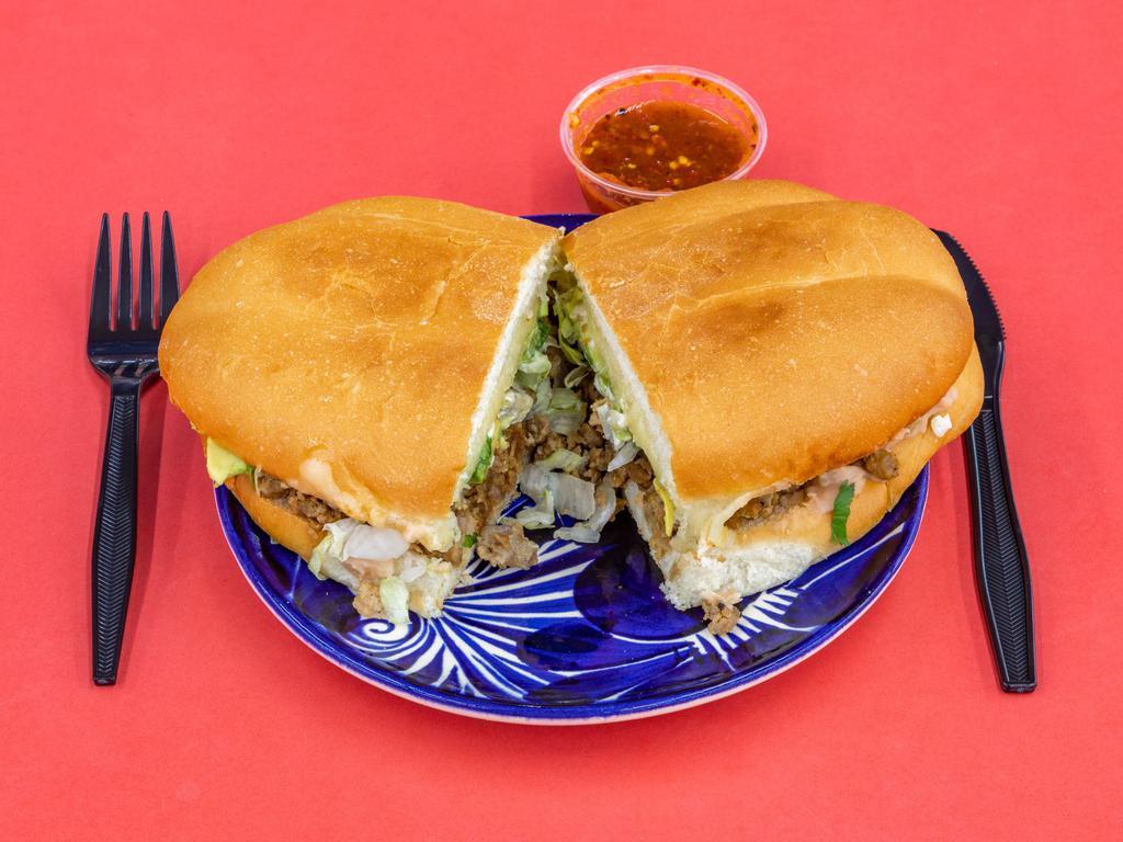 Torta · Mexican sandwich with meat other toppings
