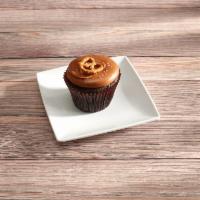 Caramel Crunch · Chocolate Cupcake topped with Caramel Icing, a pinch of salt and a Pretzel