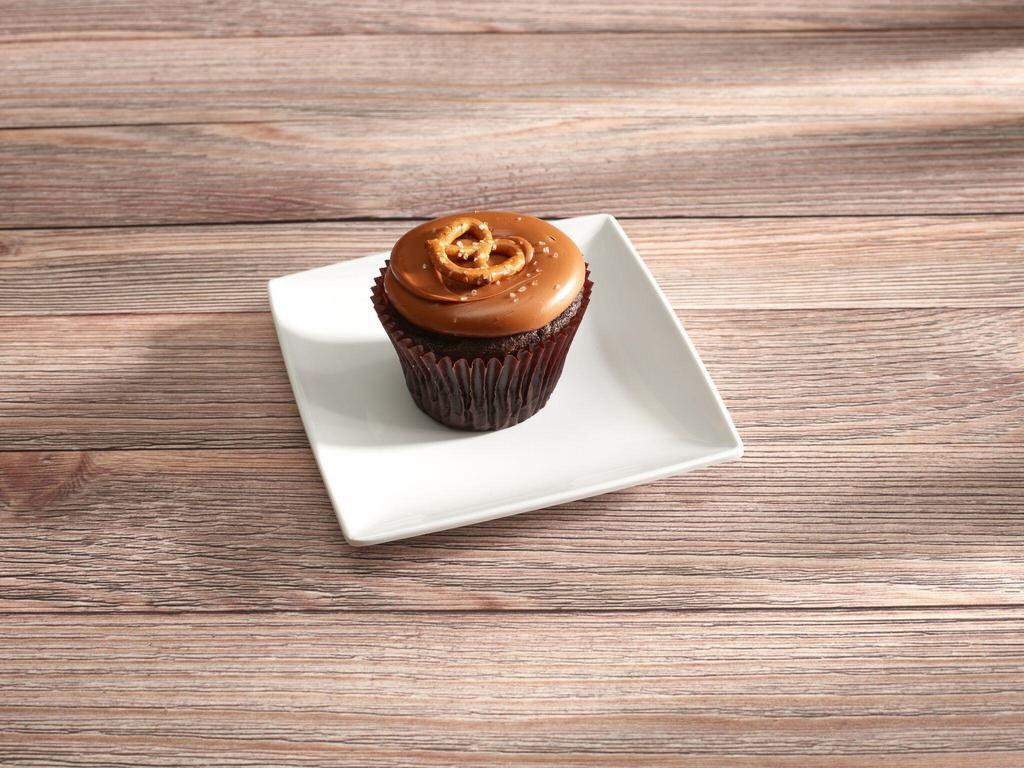 Caramel Crunch · Chocolate Cupcake topped with Caramel Icing, a pinch of salt and a Pretzel