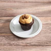 Peanut Butter Cup · Chocolate Cupcake topped with Peanut Butter Cream Cheese Icing and Reese Peanut Buttercup Cr...