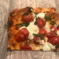 Regina Pizza · Tomato sauce, Buffalo mozzarella, cherry tomatoes and basil.