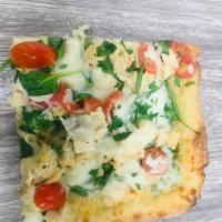 Chicken Piccata Pizza · Mozzarella, grilled lemon and garlic chicken, spinach and cherry tomato.