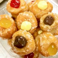 Filled Donut Holes · Glazed donut holes filled with an assortment of flavors ( Bevarian, Chocolate, Strawberry, L...