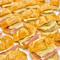 Ham, Egg and Cheese Sandwich · Sliced Ham, Egg  & Swiss cheese placed between a sliced buttery croissant