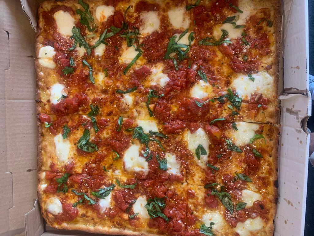 Brooklyn Pizza · Plum tomatoes, fresh mozzarella, olive oil and basil.
