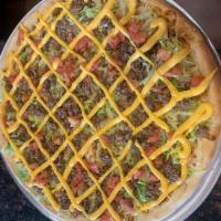 Taco Pizza · Ground beef, green peppers, tomatoes and cheddar cheese.