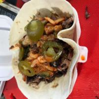 Korean Cowboy  · Brisket, dirty rice, spicy BBQ sauce, kimchi and jalapenos.