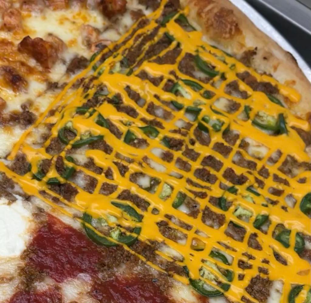 NEW Holy Nacho Pizza! · Mozzarella cheese, ground beef, jalapeños and nacho cheese sauce. 