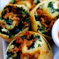 Spinach Pinwheels · Oven fresh pinwheel with spinach and mozzarella cheese