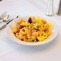 Dinner Sicilian Calamari · Pan-fried, and then sautéed with fresh tomatoes, onion, garlic, banana peppers, and Kalamata...