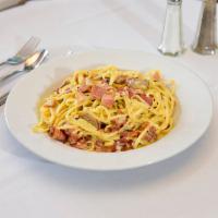 Carbonara Napoli Dinner · Pancetta and homemade sausage in a cream sauce over linguine, topped with Parmesan cheese.