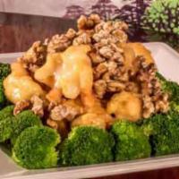E9. Walnut Shrimp · Lightly fried jumbo shrimp coated in a sweet creamy sauce, served with broccoli and topped w...