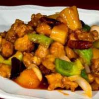 E10. Pineapple Chicken · Tender chicken, pineapple, bell peppers and onions stir-fried in a sweet and orange sauce. S...