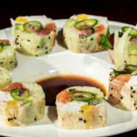 C1. Ceviche Roll · California roll with salmon, tuna, yellowtail, shrimp and yellow pickles wrapped in soy pape...