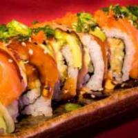 C7. Salmon Mania Roll · Spicy salmon roll topped with salmon, avocado and masago. Garnished with spicy mayo, eel sau...