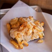 Poutine Tater · Huge Tater covered in Fries, Gravy, Tater Butter and Mozzarella