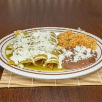 Enchiladas · 4 corn tortillas rolled and filled with chicken. Covered with red, green or mole salsa. Serv...