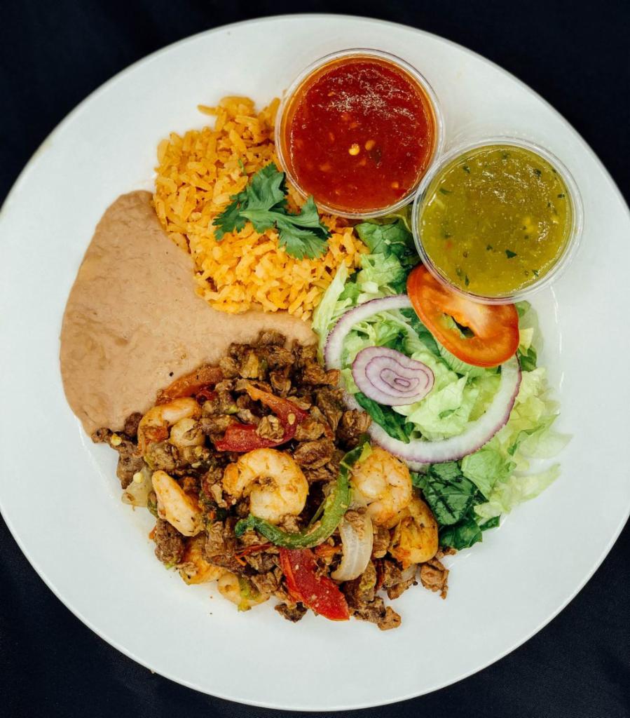 Mar y Tierra Plate · All plates served with salad, rice, beans, corn or flour tortilla and green or red chili sauce.