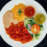 Asado de Puerco Plate · All plates served with salad, rice, beans, corn or flour tortilla and green or red chili sau...