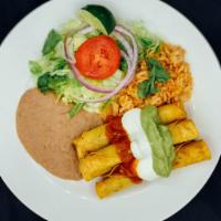 Flautas / Taquito Roll Beef Plate · Served with salad, rice, beans, sour cream, guacamole and green or red chilli sauce.
