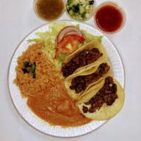 Taco Plate · 3 tacos of the meat of your choice, served with salad, rice, beans.