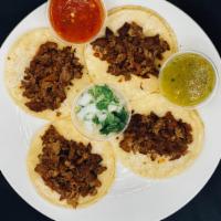 Carne Asada Taco Order · Served with salad. Rice, beans and red or green chilli sauce.