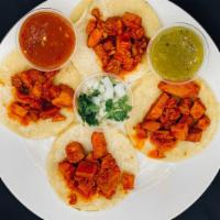 Asado de Puerco Taco Order · 4 Tacos at the meat of your choice, with red / green chilli sauce.