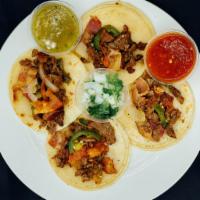 Albanil Taco Order · 4 Tacos at the meat of your choice, with red / green chilli sauce.
