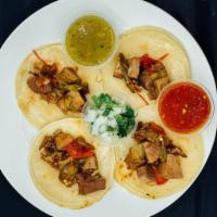 Deshebrada Tacos Order · Served with salad.  Rice, beans and red or green chilli sauce.
