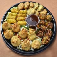 Vegetarian Platter · Samosa, aloo tiki, veg pakora, and paneer pakora.