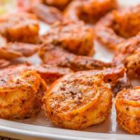 Tandoori Prawns · Jumbo prawns marinated in a unique blend of our tasty spices, herbs then roasted in the tand...